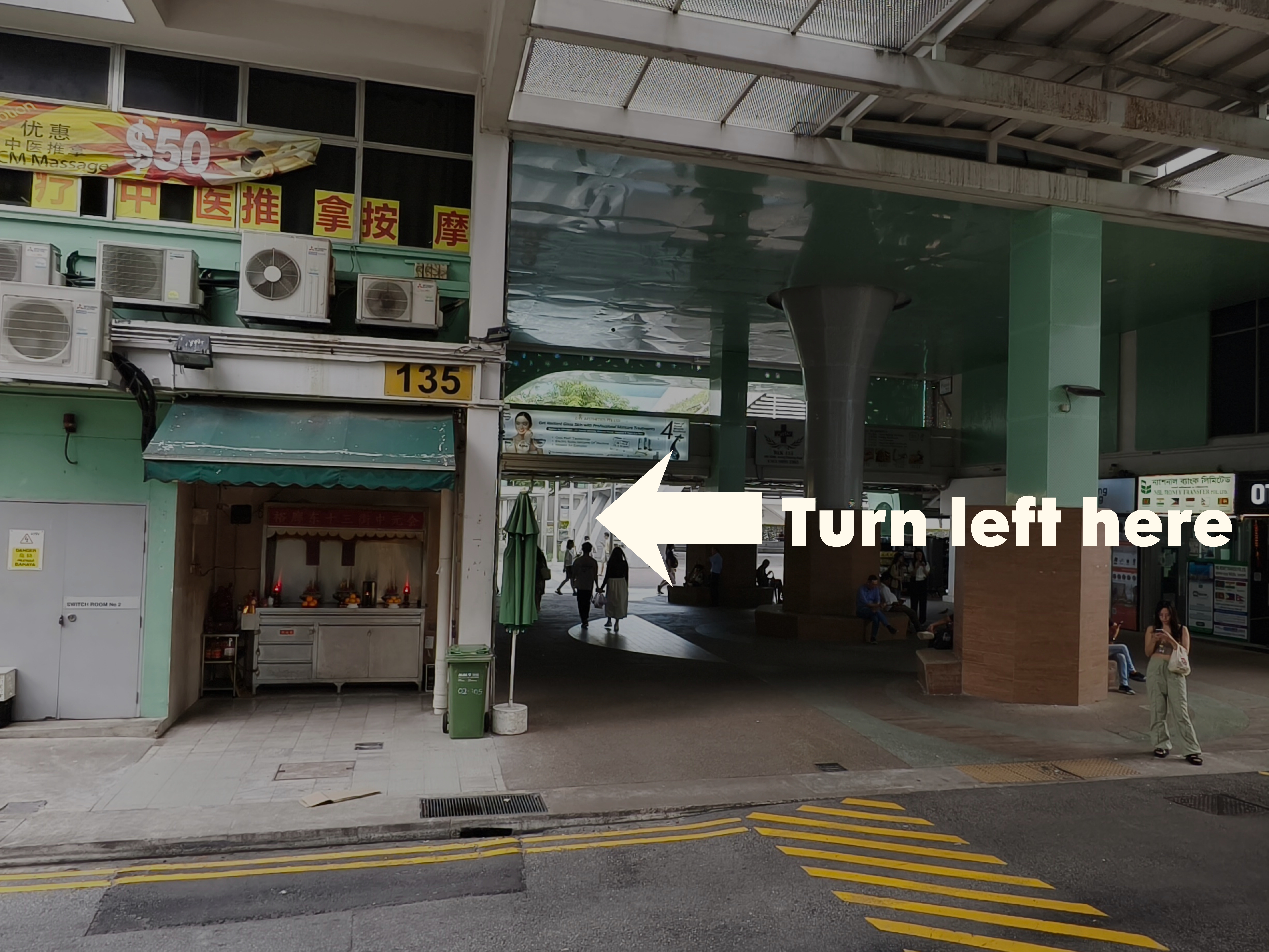 Turn left towards MoneyMax at the Block 135 drop-off point